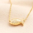 Fish Pendant Necklace in Gold on neutral background