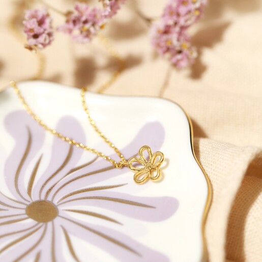 Delicate Flower Outline Pendant Necklace in Gold on model