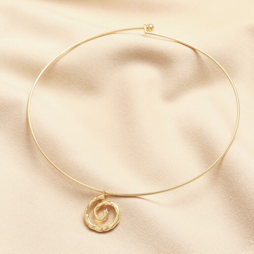 Torque Spiral Shell Hammered Pendant Necklace in Gold on a neutral background