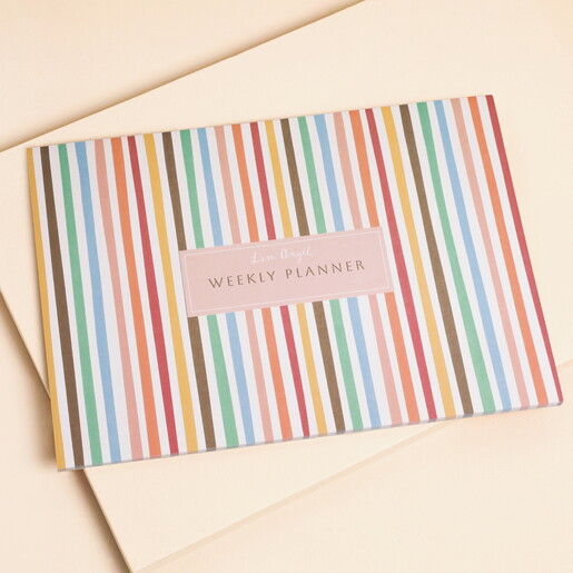 Rainbow Stripes Colourful Weekly Planner on a neutral background