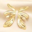 Big Metal London Floral Stainless Steel Earrings in Gold on a neutral cream background