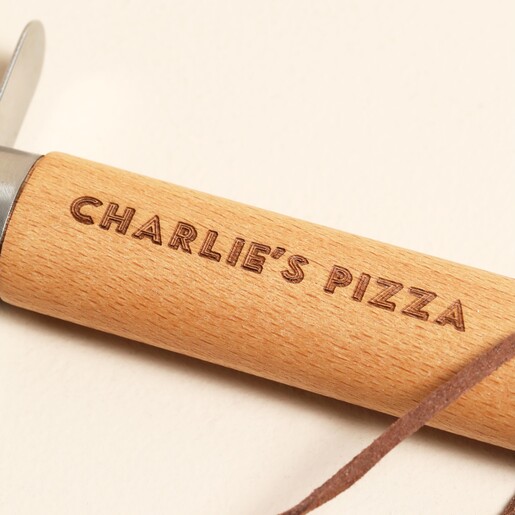 Close Up of Peronsalised Wooden Pizza Cutter