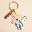 A colourful keyring in a spring-themed style