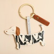 A black and white sausage dog keyring