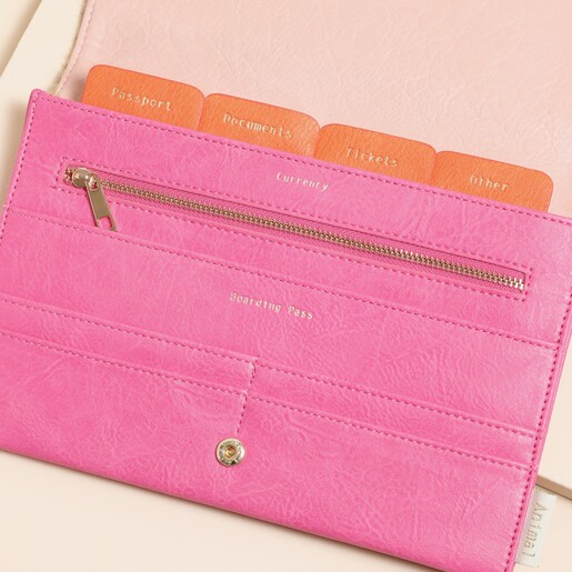 A vegan leather travel wallet with orange accents