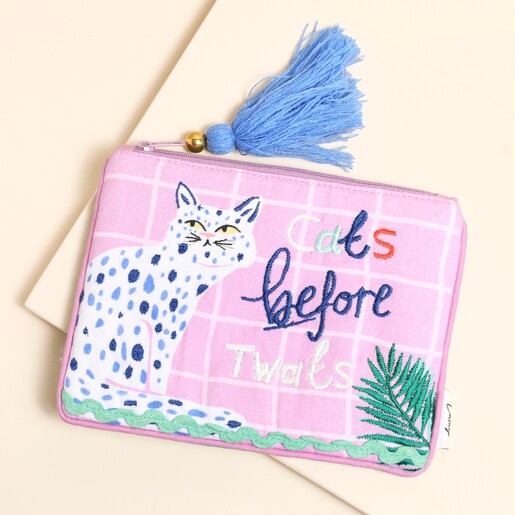 A purse with a playful slogan and cat illustration