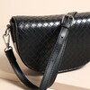 Close Up of Textured Vegan Leather Half Moon Crossbody Bag in Black