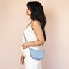 Model Shot of Vegan Leather Half Moon Crossbody Bag in Blue
