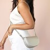 Model Shot of Vegan Leather Half Moon Crossbody Bag in Silver