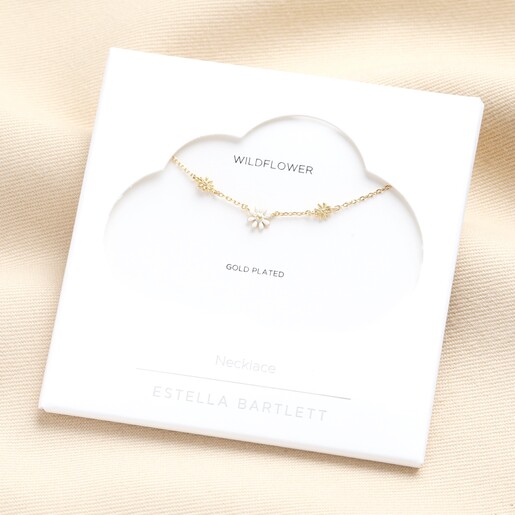 Estella Bartlett Triple Flower White Enamel Necklace in Gold in packaging