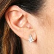 Close Up of White Enamel Double Flower Stud Earrings in Silver Model