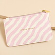 An eye-catching purse in pink and white