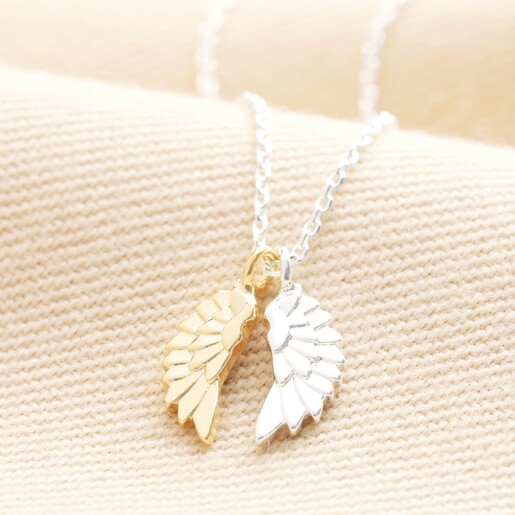 Estella Bartlett Wings Necklace on a neutral background