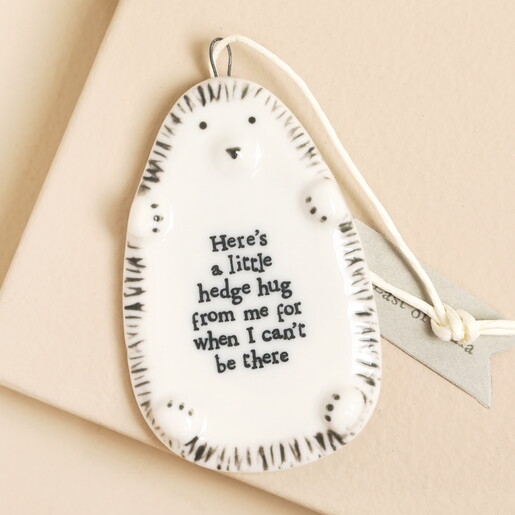 A cute porcelain hedgehog hanging ornament