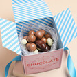 The Chocolate Gift Company Chocolates open with striped blue and white inner