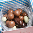 The Chocolate Gift Company Chocolates open with striped blue and white inner close up