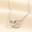 Stainless Steel Interlocking Rings Necklace in Silver on a neutral background