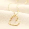 Stainless Steel Organic Shape Heart Outline Pendant Necklace in Gold on a neutral background