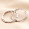 Stainless Steel Slim Hoop Earrings in Silver on neutral background