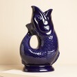 A large gurgle jug in a dark shade of blue