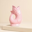 A miniature ceramic gurgle jug in pink