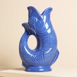 A vibrant blue medium-sized ceramic gurgle jug