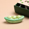 Cloe Up of Tiny Matchbox Ceramic Peas in a Pod Token