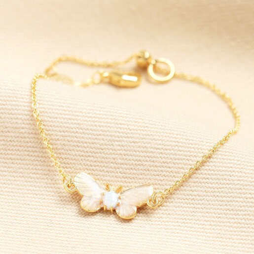 A semi-precious bracelet made from 14ct gold plating, whilst the centrepiece features a stunning open-wing butterfly with shiny pink wings and an opal centre. 