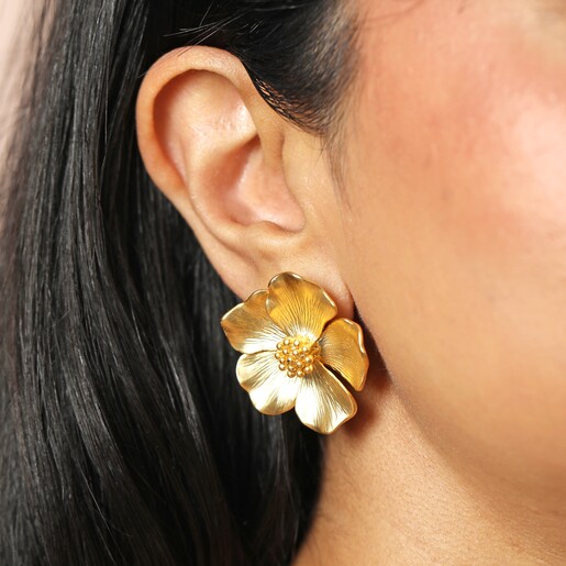 Oversized Flower Stud Earrings in Goldon a Beige Background