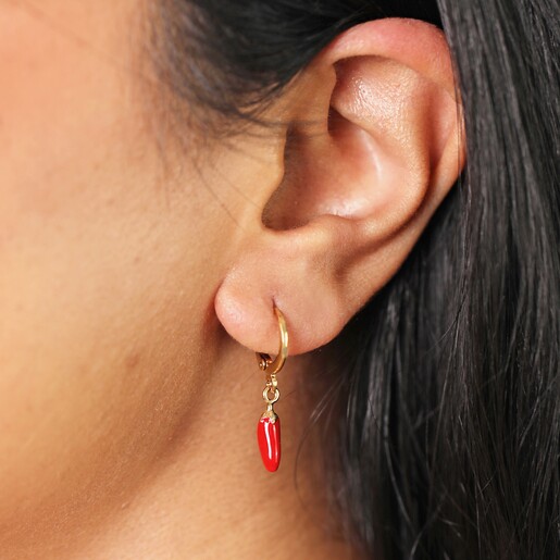 Close Up Model Shot Close Up Model Shot of Red Chilli Huggie Hoop Earrings in Gold