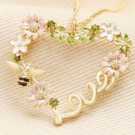 Close Up of Crystal Flower and Bee 'Love' Pendant Necklace in Gold