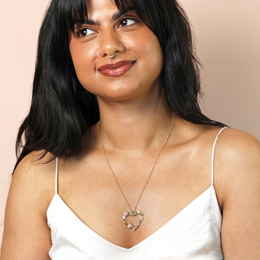 Model Shot of Crystal Flower and Bee 'Love' Pendant Necklace in Gold