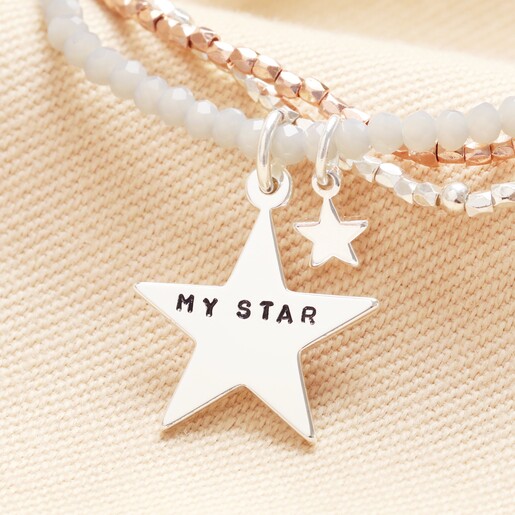Close up Personalised Mixed Metal Star Charm Multi Layer Beaded Bracelet on neutral background