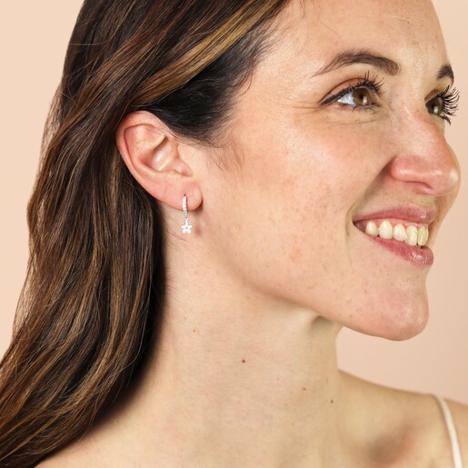 Model Shot of Sterling Silver Flower Crystal Huggie Hoop Earrings in Silver