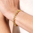 Close Up Model Shot of Flower Beaded Bracelet in Gold on Model