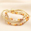 Set of 3 Stainless Steel Orange Layered Beaded Bracelets in Gold