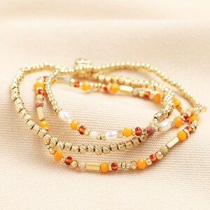 Set of 3 Stainless Steel Orange Layered Beaded Bracelets in Gold