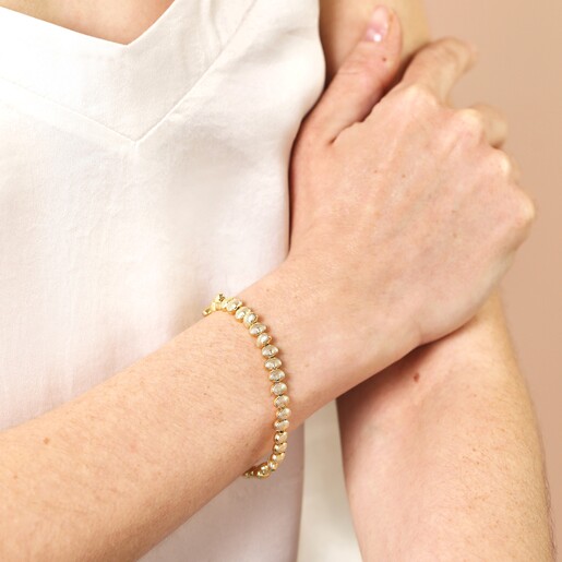 Close Up of Shell Beaded Bracelet in Gold on Model