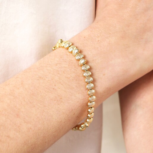 Close Up of Shell Beaded Bracelet in Gold on Model