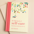 The Little Book of Self Care Book on a neutral background