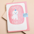 Laura Skilbeck Let's Party Dog Birthday Card with a pink envelope on a neutral background