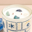 North Muse Crystal Cove Sea Salt & Sage Candle on a neutral background with crystals