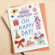 This charming card features birthday-themed illustrations such as colourful presents and cakes.