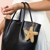 Beaded Starfish Keyring and Bag Charm on a Beige Background