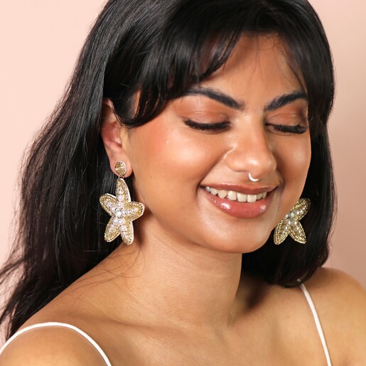 Model Shot Model Shot of the Bead and Pearl Starfish Drop Earrings in Gold