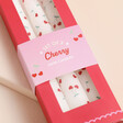 Close up of Set of 3 Heart Cherry Taper Candles packagaing