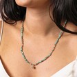 Close Up Model Shot of Green Shell Charm Beaded Necklace in Gold on Model