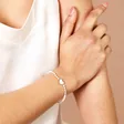 Model Shot of Mother of Pearl Bead and Shell Heart Charm Bracelet in Gold