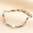 A multicoloured bracelet with a freshwater pearl.