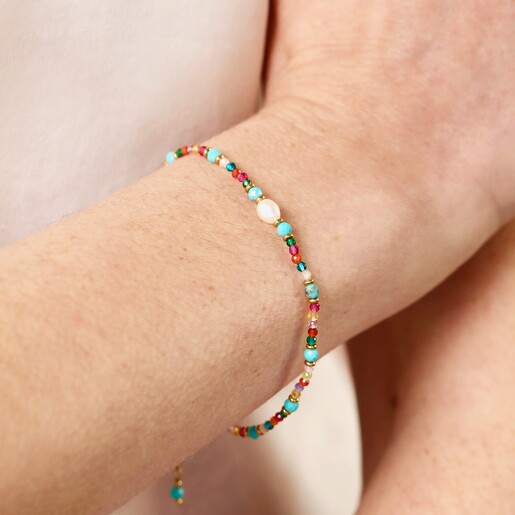 Close Up on Model Close Up of  Multicoloured Semi Precious Beaded Bracelet with Freshwater Pearl on Model